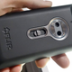 The original FLIR One smartphone case photographed being held.